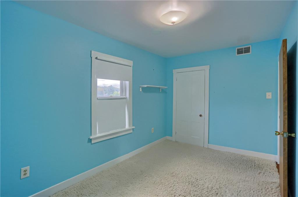 516 17th Street Beaver Falls, PA 15010 - Photo 23 of 28 an empty room with windows