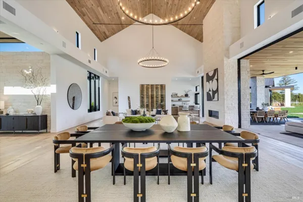 a kitchen with a dining table and chairs