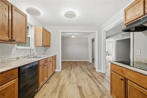 a kitchen with a sink and cabinets