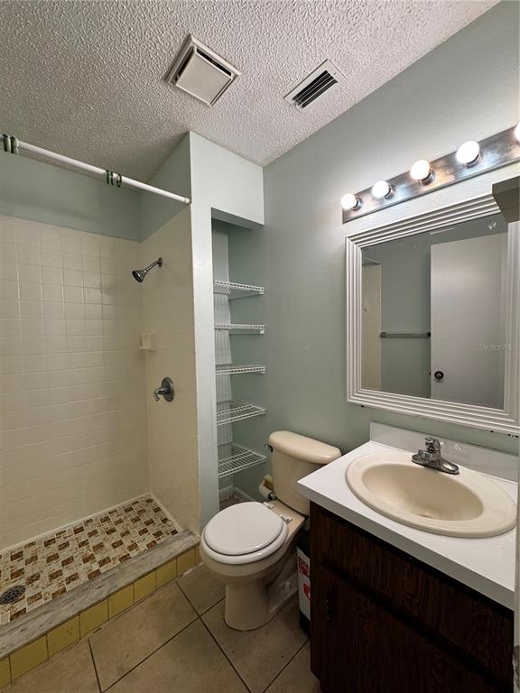 1755 Southwest 108th Lane, Unit 2 Ocala, FL 34476 - Photo 11 of 16 a bathroom with a sink toilet a shower and a mirror