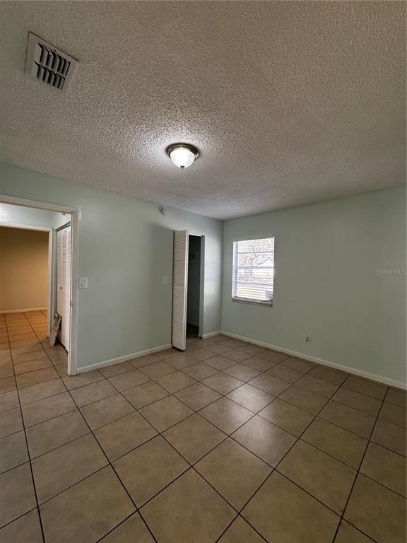 1755 Southwest 108th Lane, Unit 2 Ocala, FL 34476 - Photo 13 of 16 a view of an empty room and window