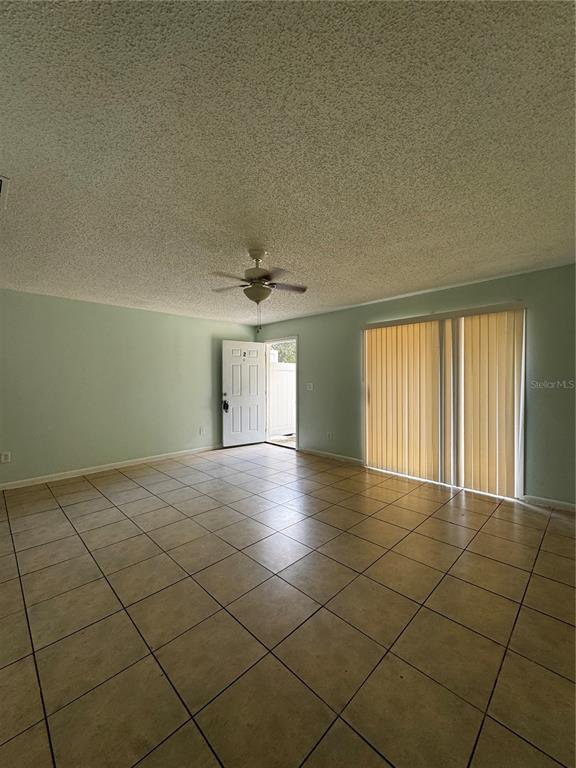 1755 Southwest 108th Lane, Unit 2 Ocala, FL 34476 - Photo 4 of 16 a view of an empty room and a window