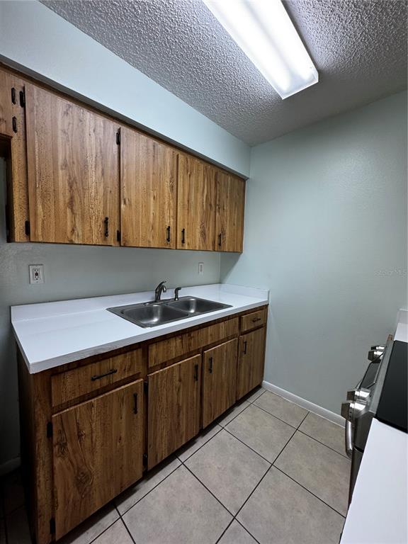 1755 Southwest 108th Lane, Unit 2 Ocala, FL 34476 - Photo 7 of 16 a kitchen with a sink and cabinets