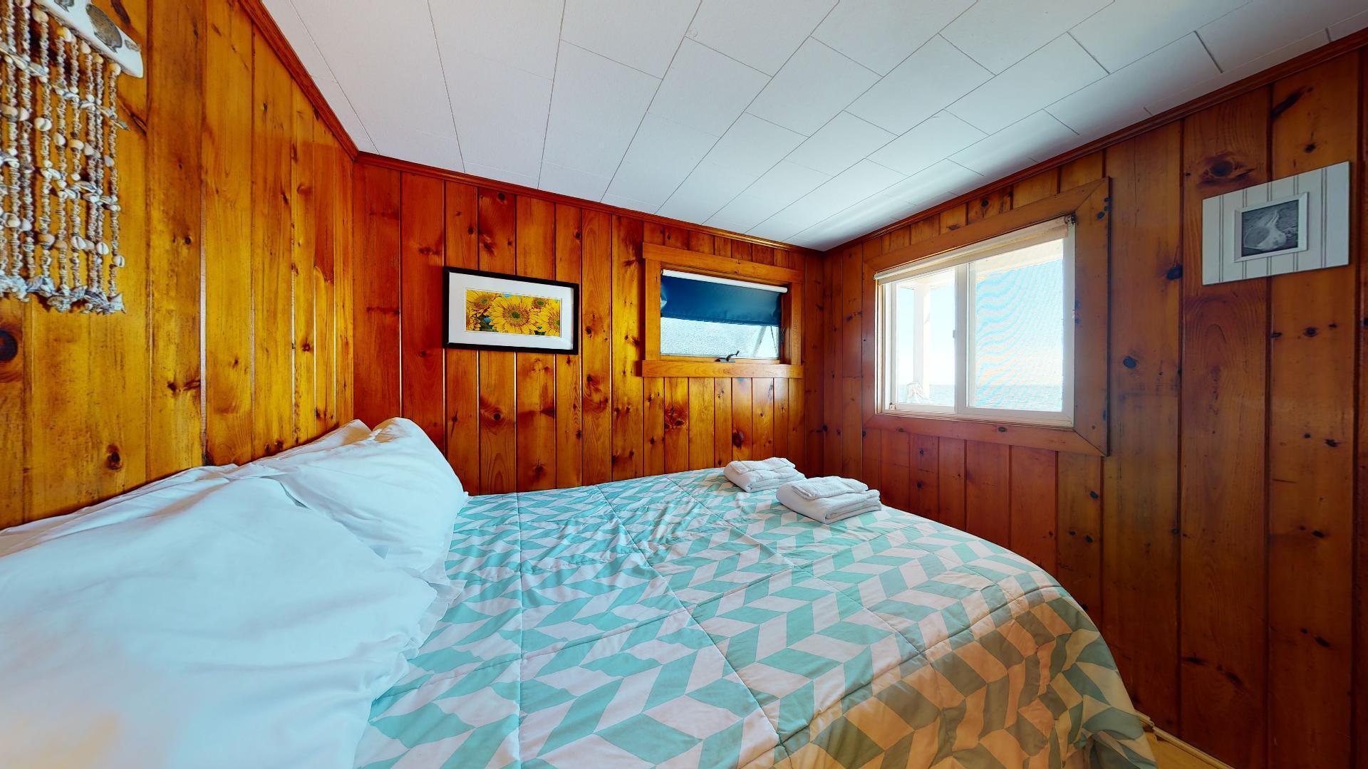 314 Shore Road, Unit 4 5 Truro, MA 02666 - Photo 21 of 50 a bedroom with a bed and a window