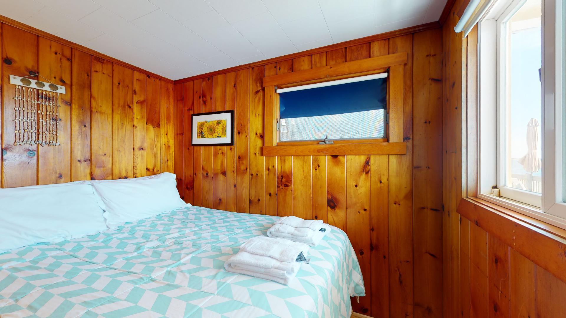 314 Shore Road, Unit 4 5 Truro, MA 02666 - Photo 22 of 50 a bedroom with a bed and a window