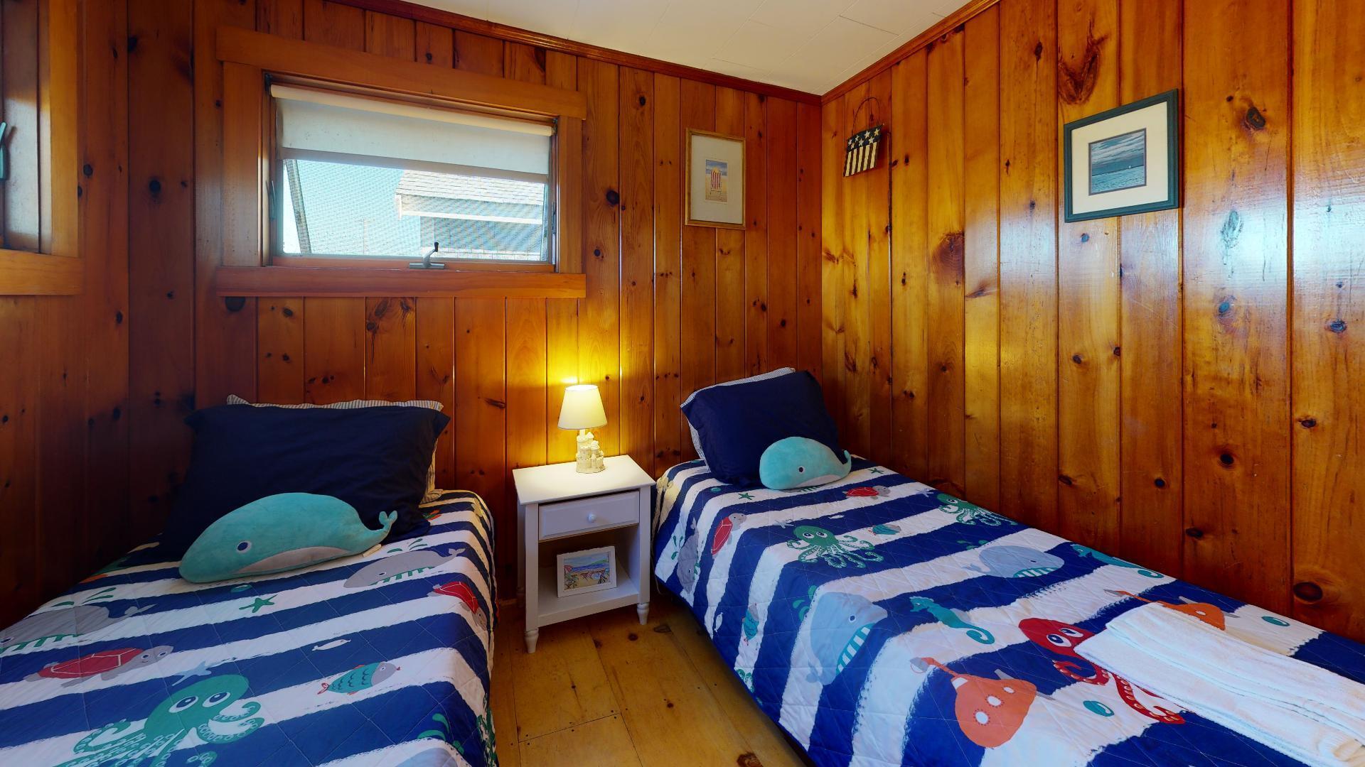 314 Shore Road, Unit 4 5 Truro, MA 02666 - Photo 24 of 50 a bedroom with a bed and a window