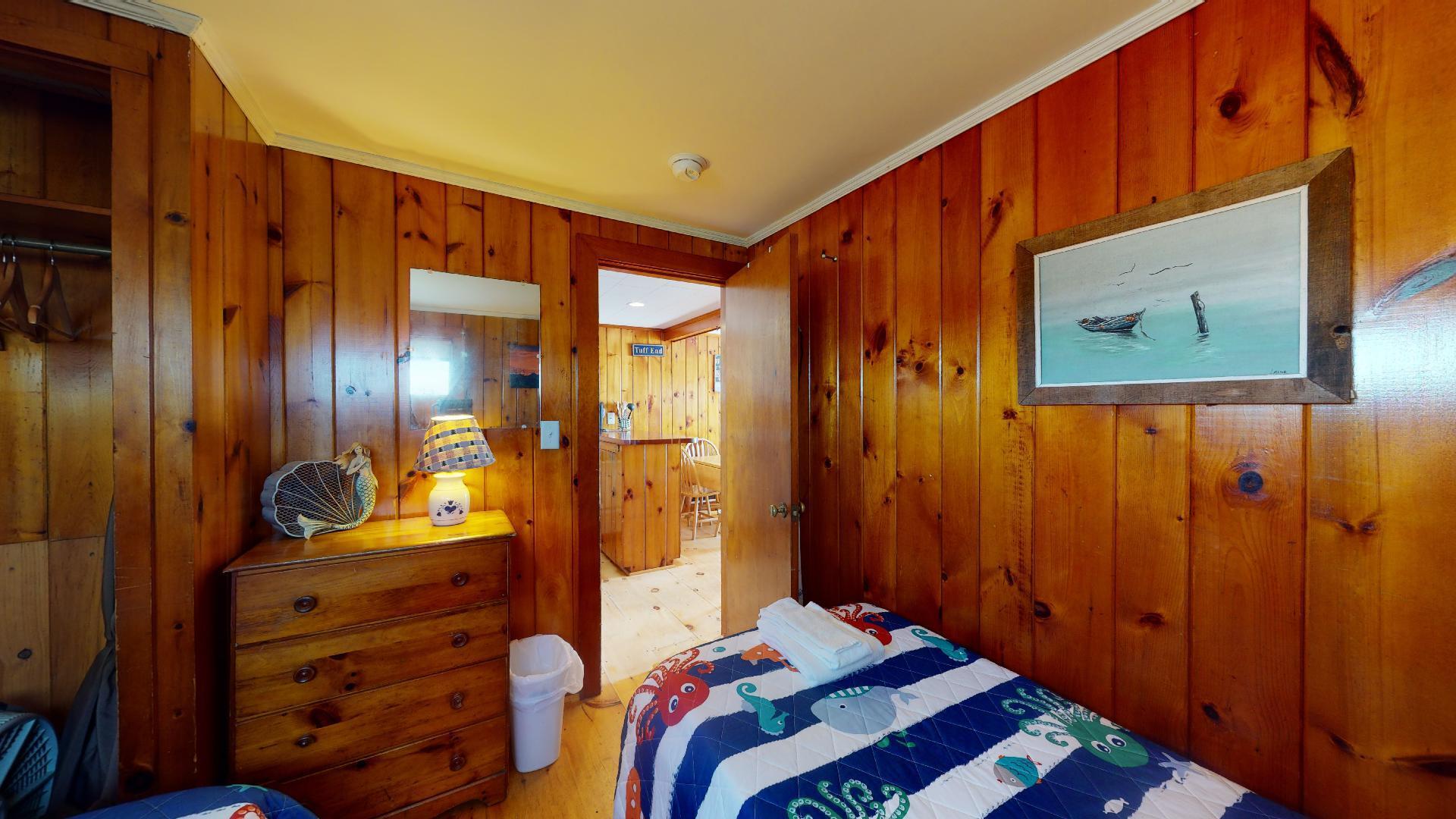 314 Shore Road, Unit 4 5 Truro, MA 02666 - Photo 40 of 50 a bedroom with a bed and a dresser