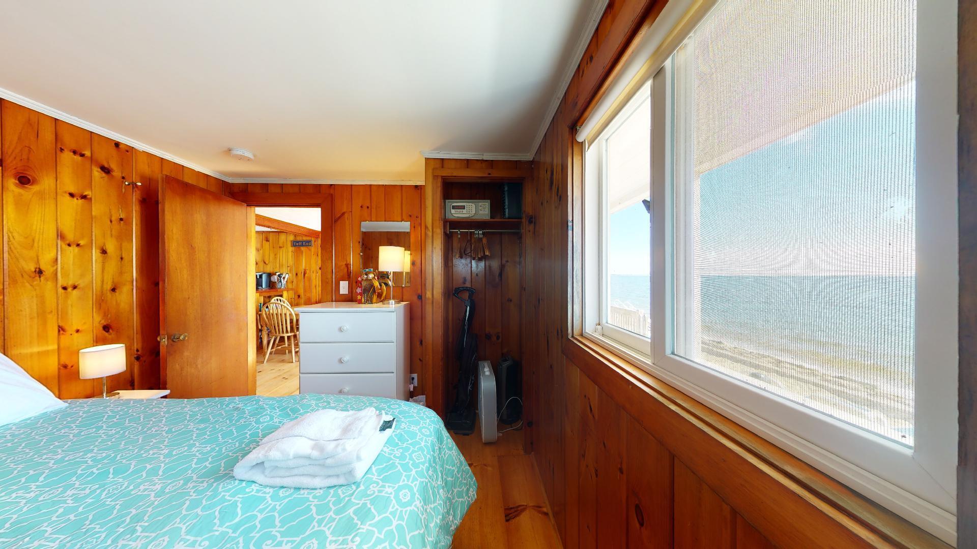 314 Shore Road, Unit 4 5 Truro, MA 02666 - Photo 43 of 50 a bedroom with a bed and a dresser next to a window