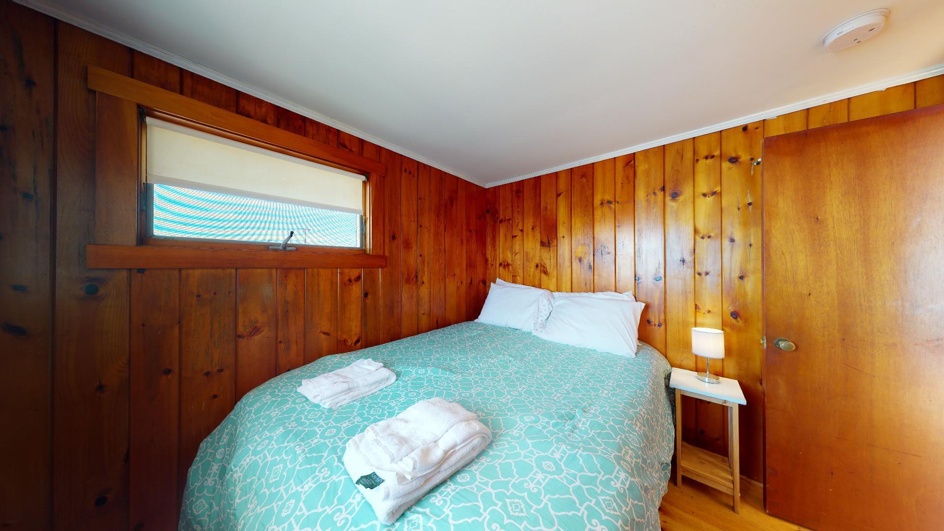 314 Shore Road, Unit 4 5 Truro, MA 02666 - Photo 45 of 50 a bedroom with a bed and a dresser