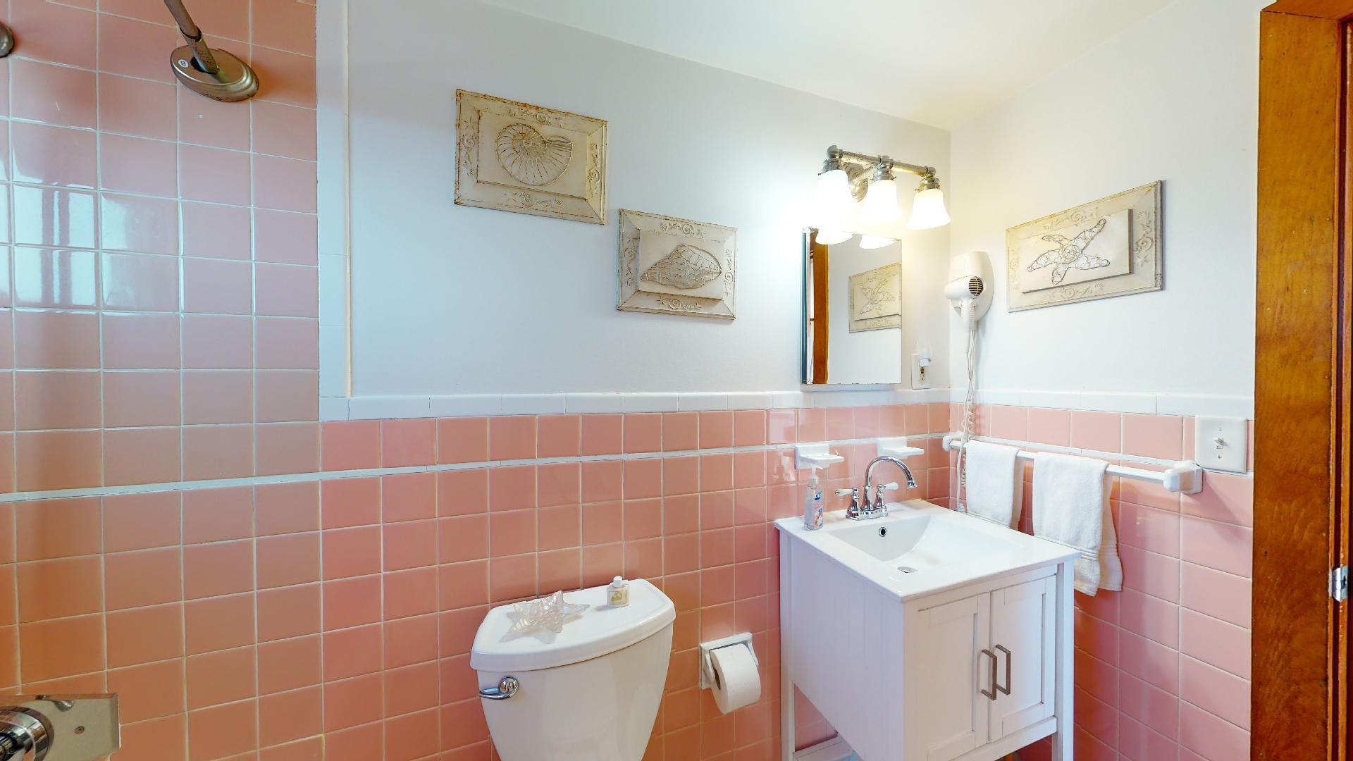 314 Shore Road, Unit 4 5 Truro, MA 02666 - Photo 48 of 50 a bathroom with a sink a toilet and a mirror