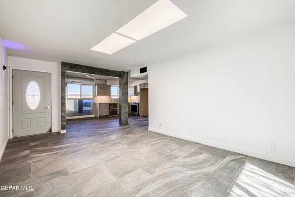a view of livingroom with hardwood floor and kitchen view