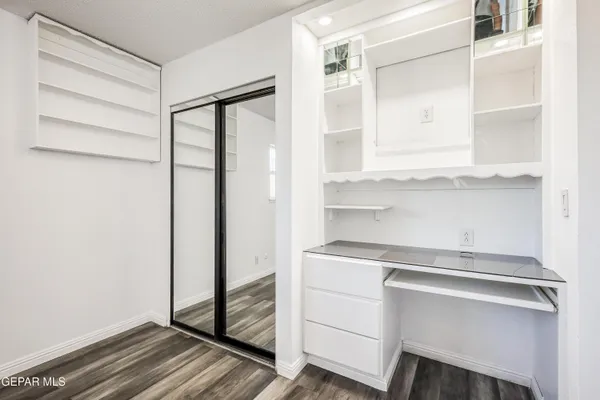 a bathroom with a granite countertop toilet sink and shower
