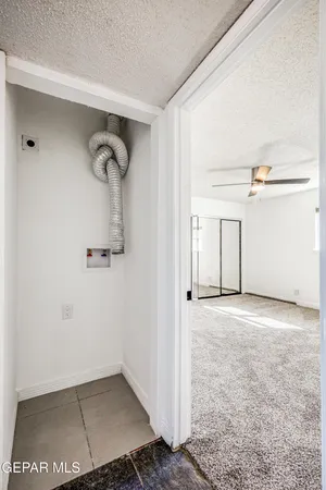 an empty room with windows and entrance