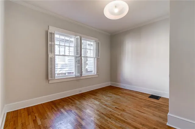 a view of a bathroom with wooden floor