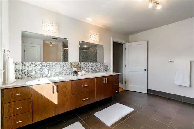 a room with a window and a dresser