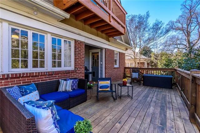 a view of a balcony with furniture