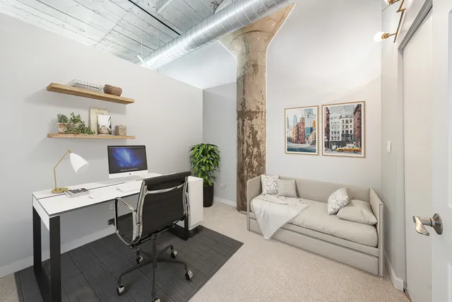 a workspace with furniture and window