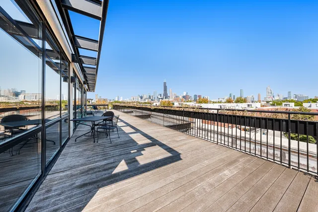 a view of roof deck with patio