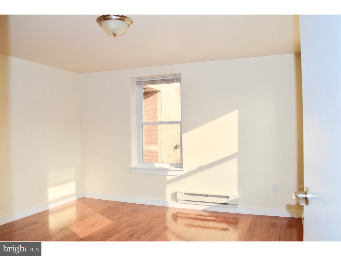 415 South Broad Street, Unit 3F Philadelphia, PA 19147 - Photo 5 of 13 a view of a livingroom with wooden floor