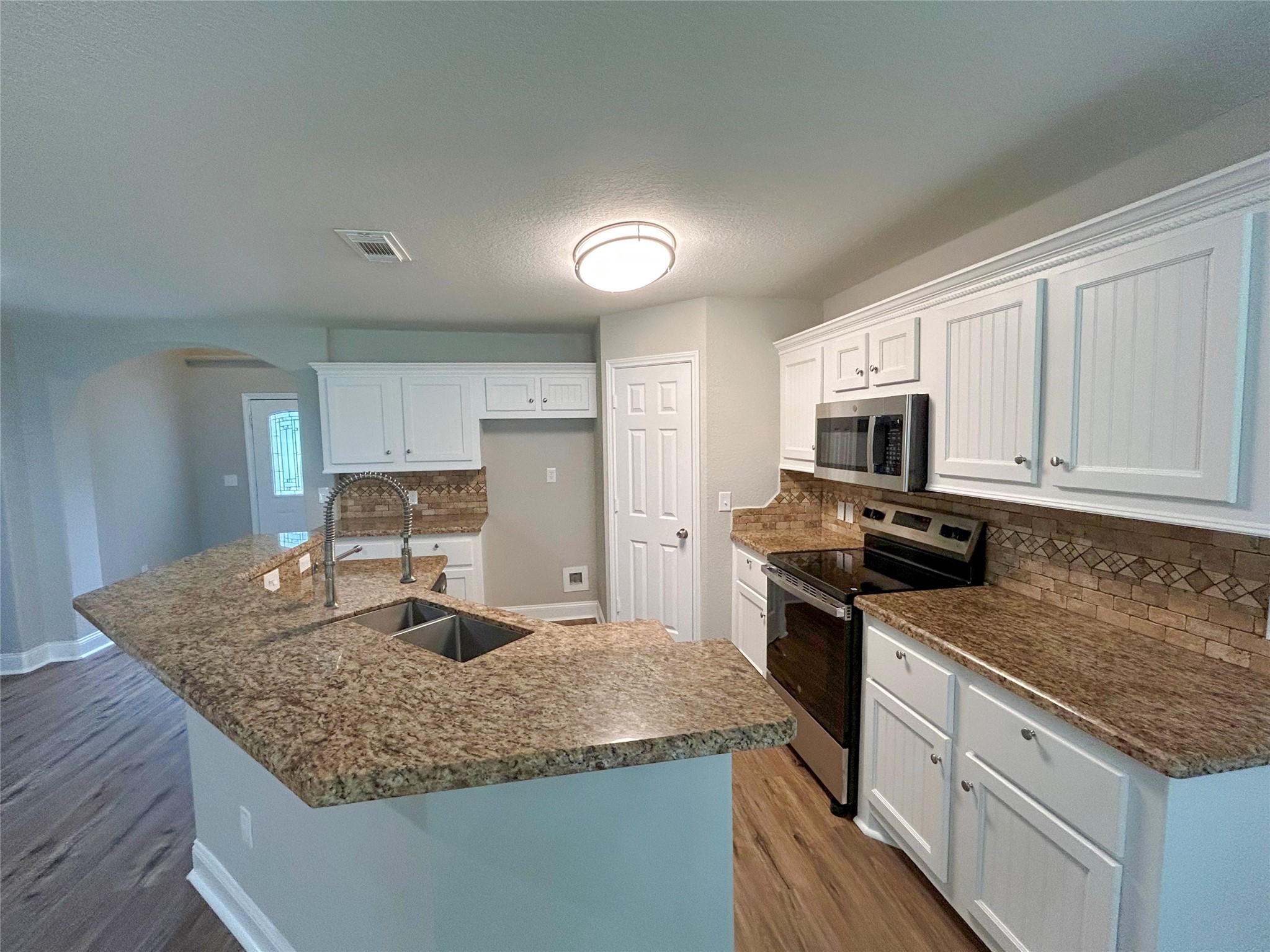7902 Masters Manvel, TX 77578 - Photo 7 of 21 Look at the beautiful kitchen countertops and freshly painted cabinets.
