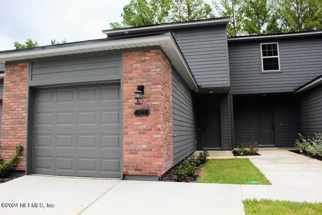 a front view of a house with yard