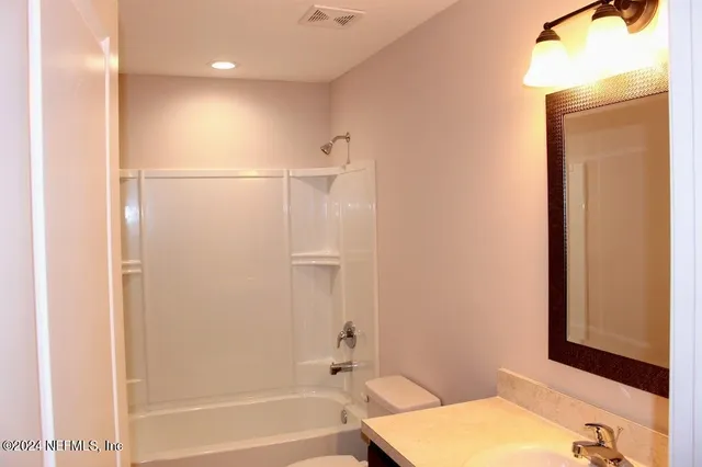 an empty room with an entrance to other room