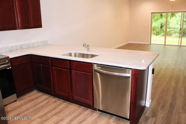 a kitchen with a sink and a window