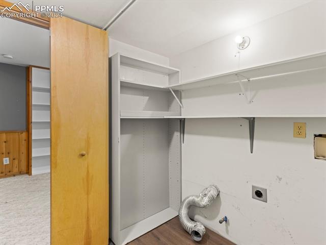 7590 Julynn Road Colorado Springs, CO 80919 - Photo 18 of 44 Washroom with hookup for a gas dryer, electric dryer hookup, and wood-type flooring