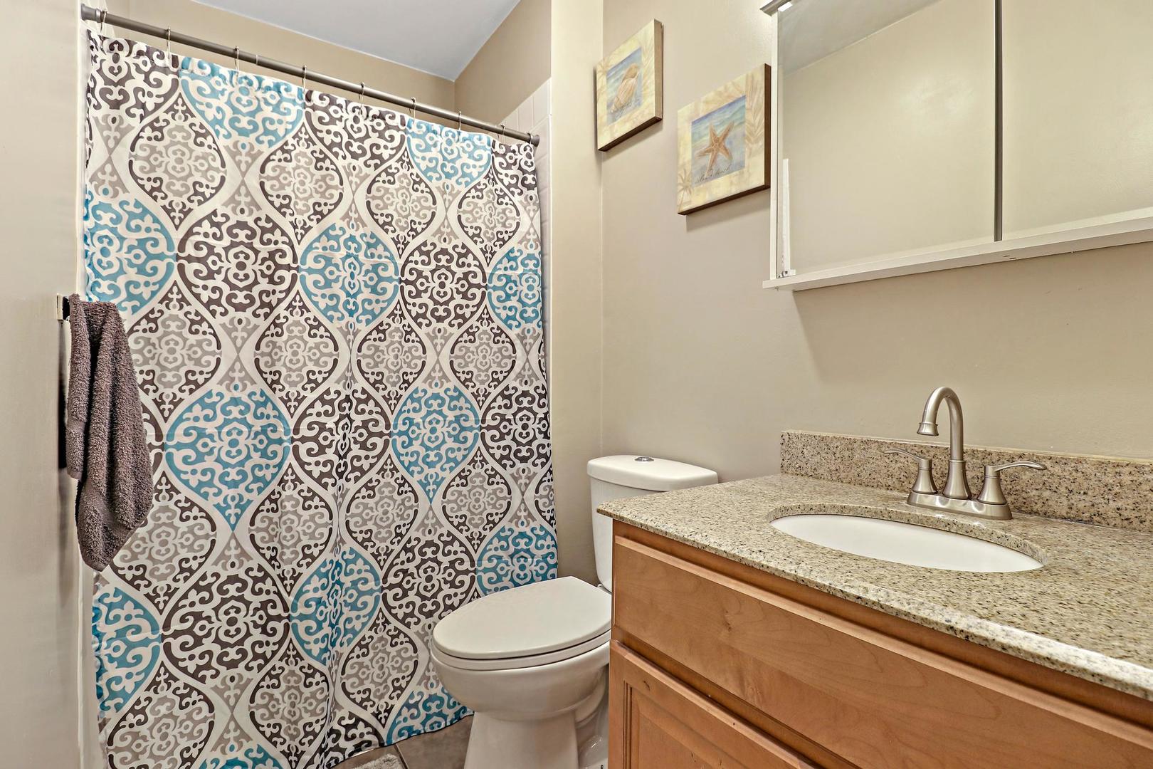 10254 West Beach Road Beach Park, IL 60099 - Photo 16 of 25 a bathroom with a granite countertop toilet sink and mirror