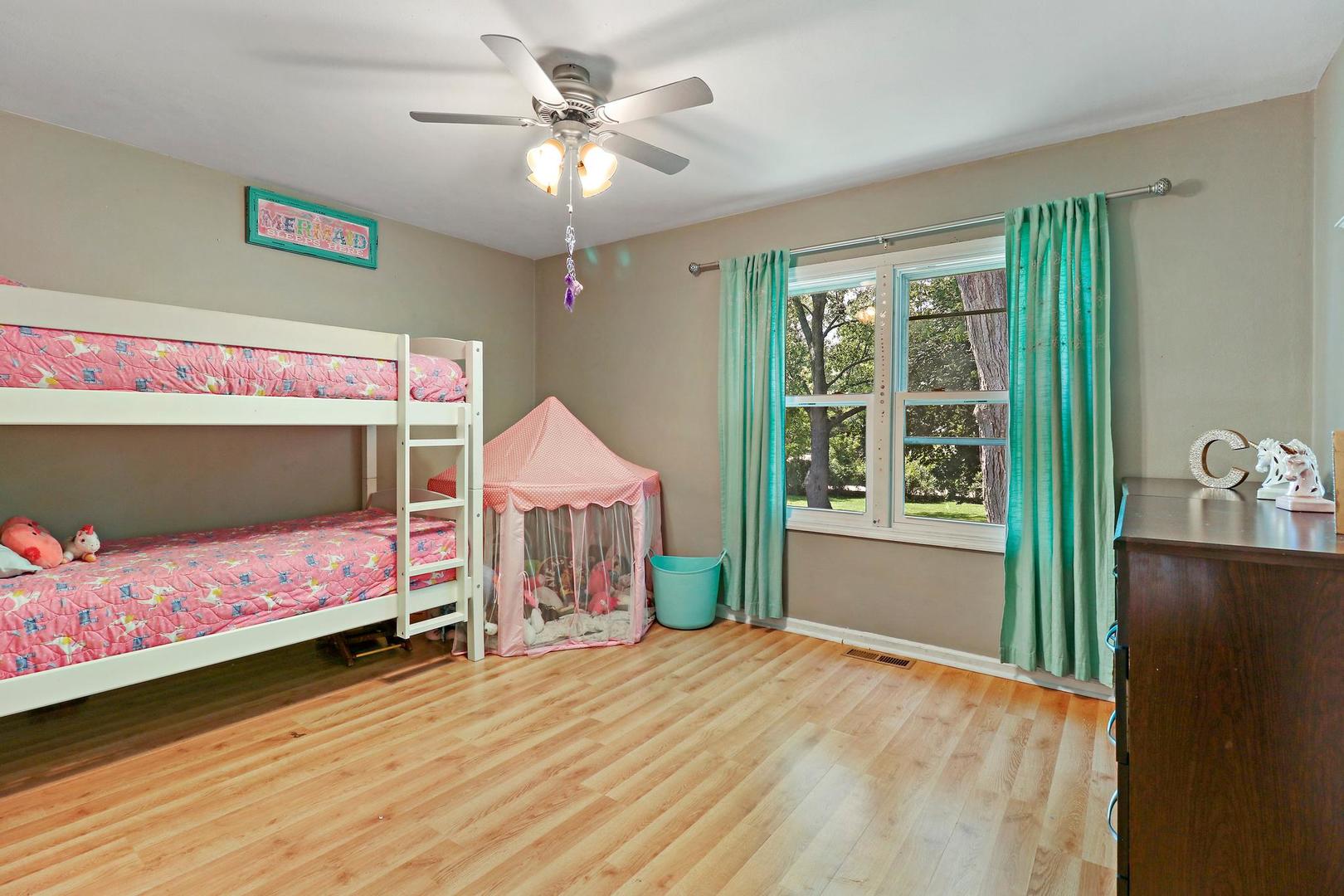 10254 West Beach Road Beach Park, IL 60099 - Photo 17 of 25 a bedroom with a bed and a window