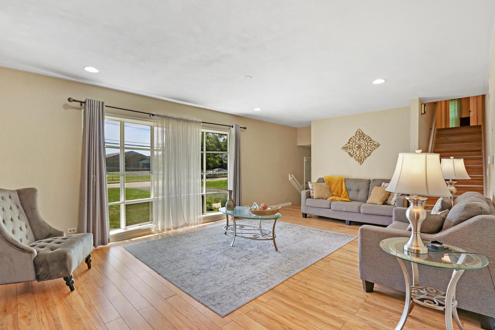 10254 West Beach Road Beach Park, IL 60099 - Photo 4 of 25 a living room with furniture and a large window