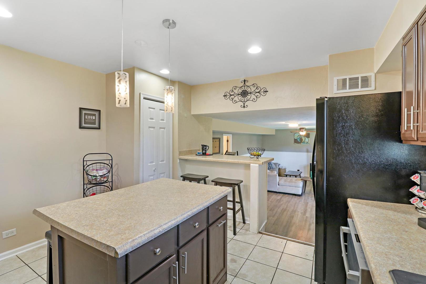10254 West Beach Road Beach Park, IL 60099 - Photo 7 of 25 a spacious bathroom with a sink a mirror and a shower