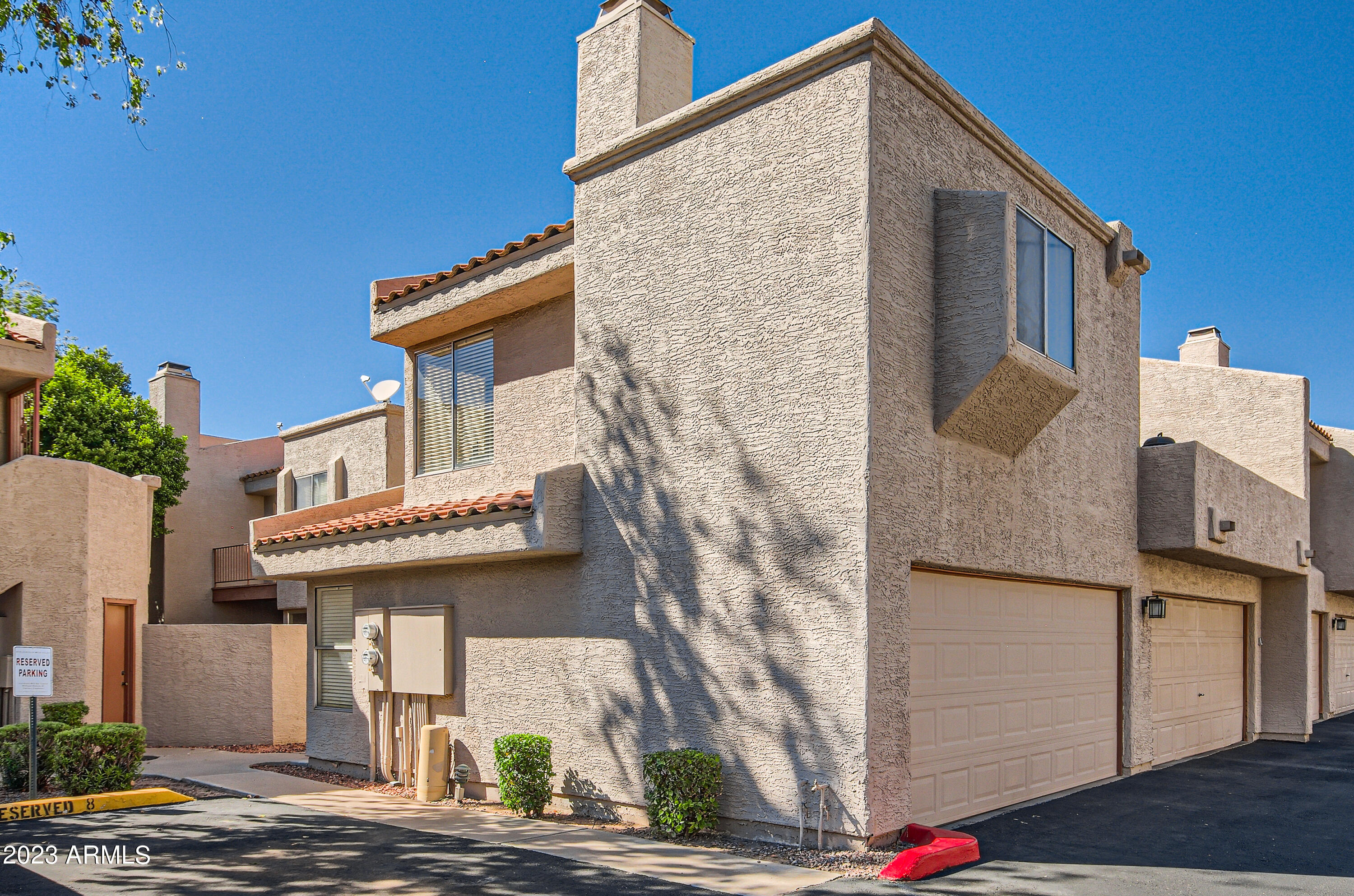 2834 South Ext Road, Unit 2093 Mesa, AZ 85210 - Photo 14 of 17 a front view of a house with a yard