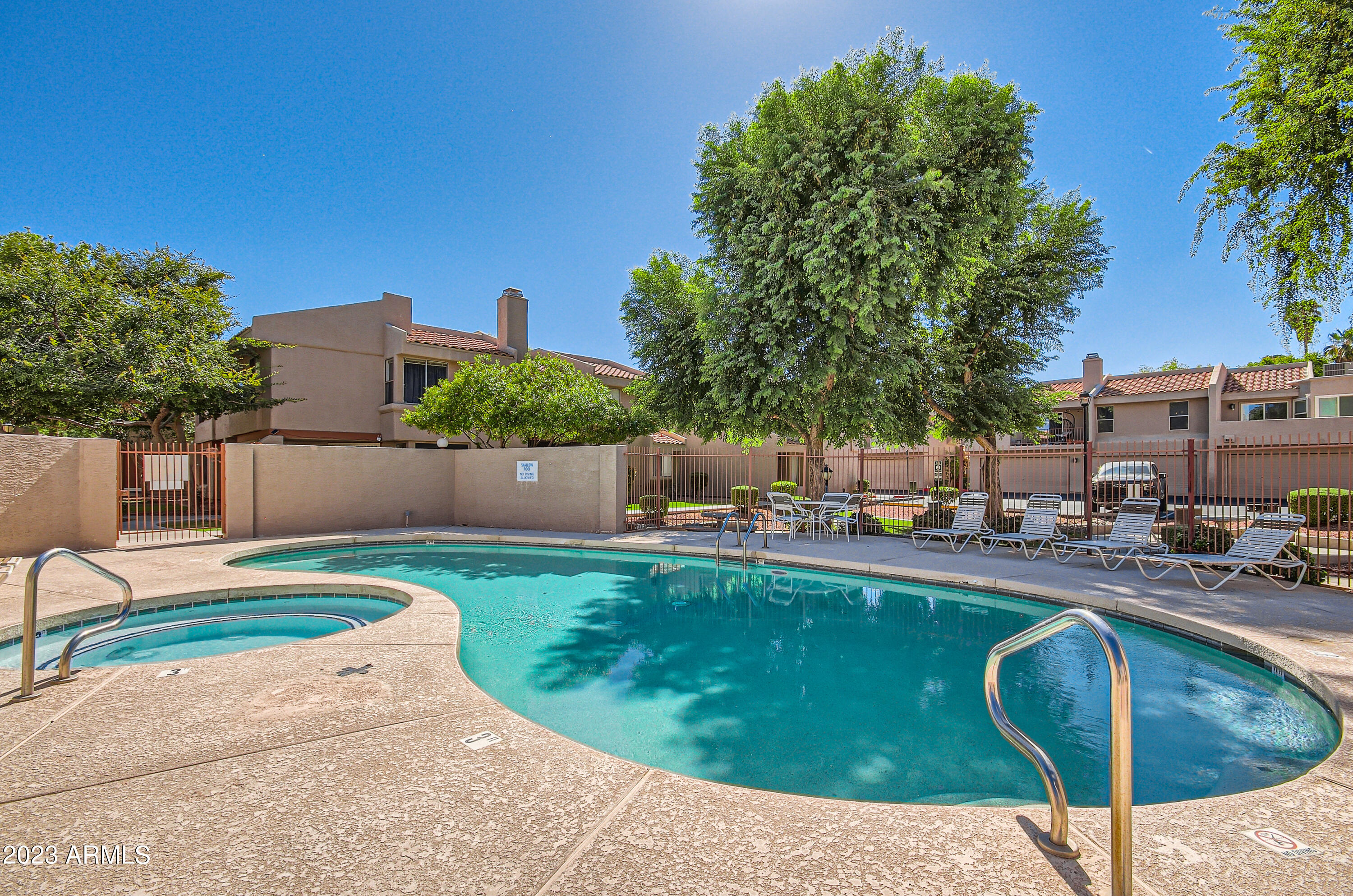 2834 South Ext Road, Unit 2093 Mesa, AZ 85210 - Photo 15 of 17 a view of a backyard with swimming pool