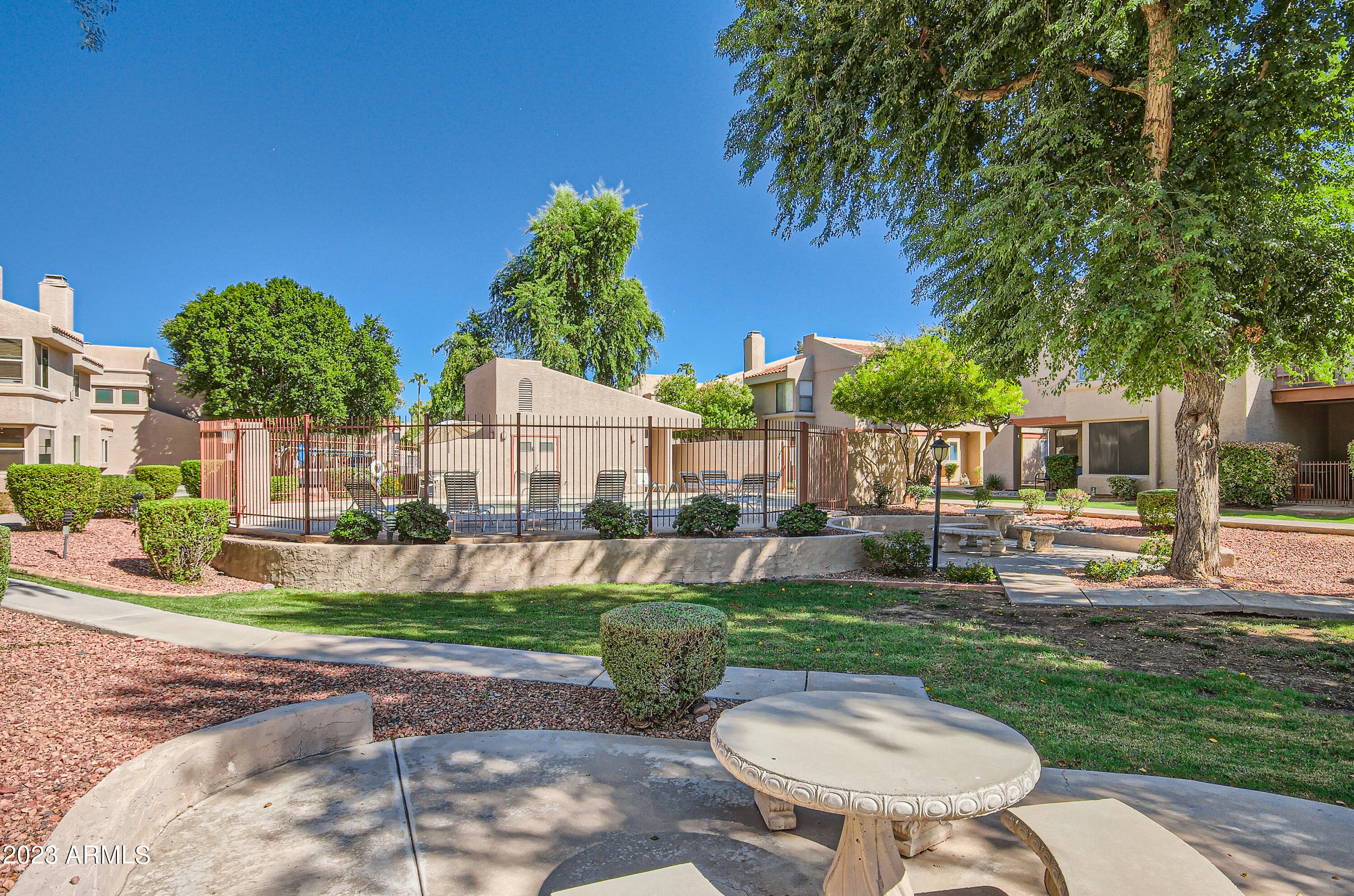 2834 South Ext Road, Unit 2093 Mesa, AZ 85210 - Photo 17 of 17 a view of a house with backyard porch and sitting area
