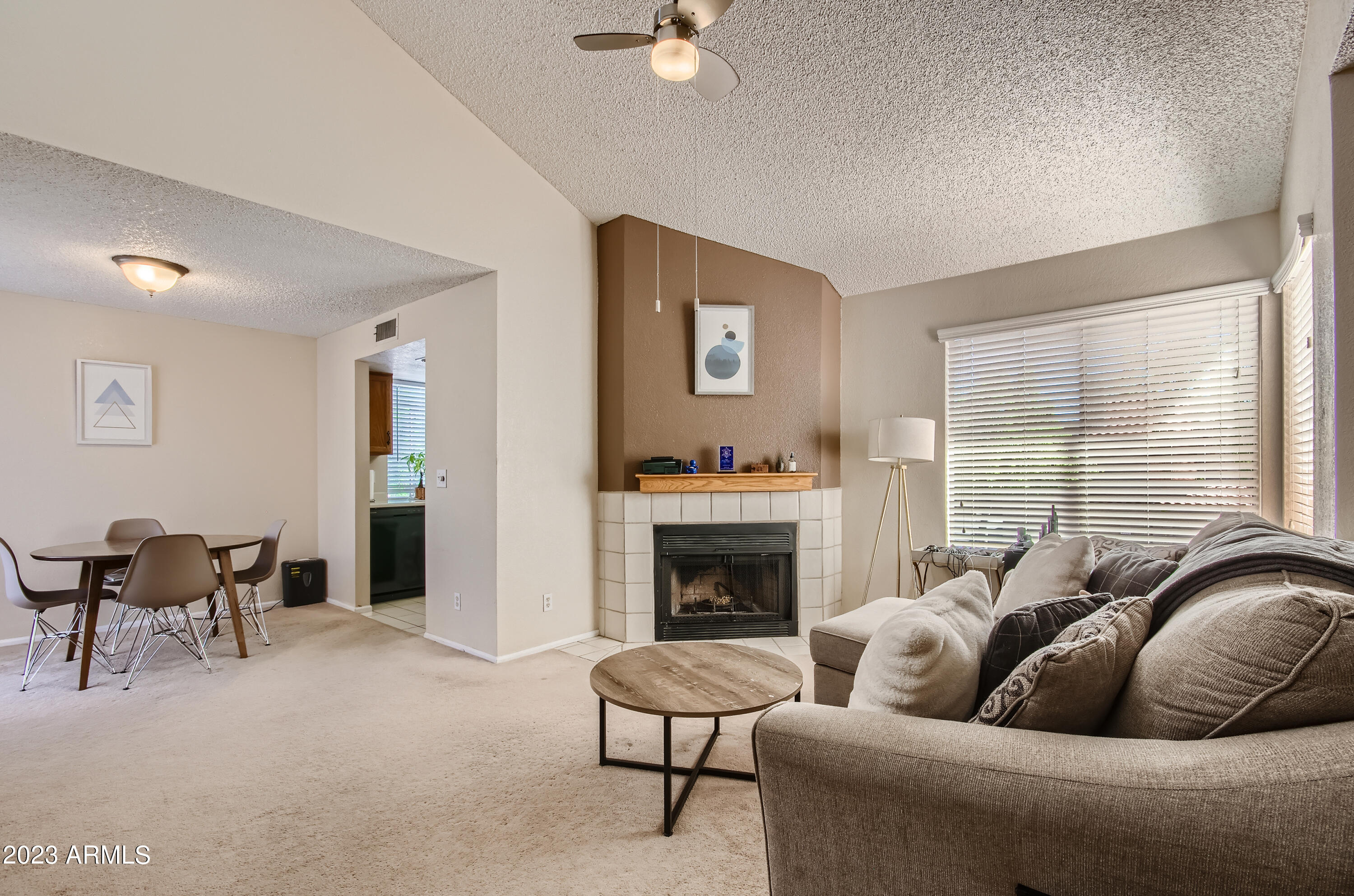 2834 South Ext Road, Unit 2093 Mesa, AZ 85210 - Photo 3 of 17 a living room with furniture and a fireplace