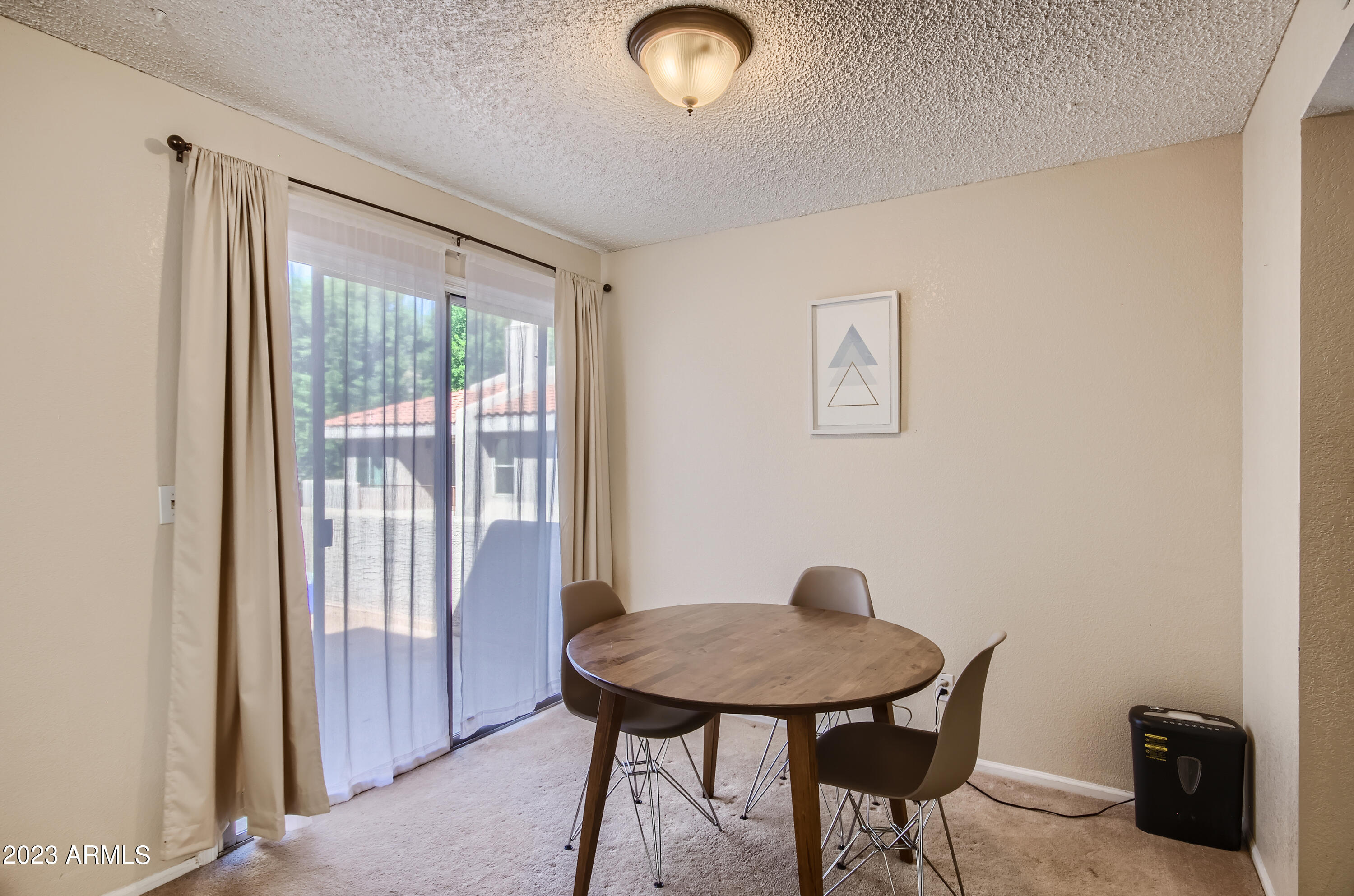 2834 South Ext Road, Unit 2093 Mesa, AZ 85210 - Photo 4 of 17 a view of a workspace with furniture and a window