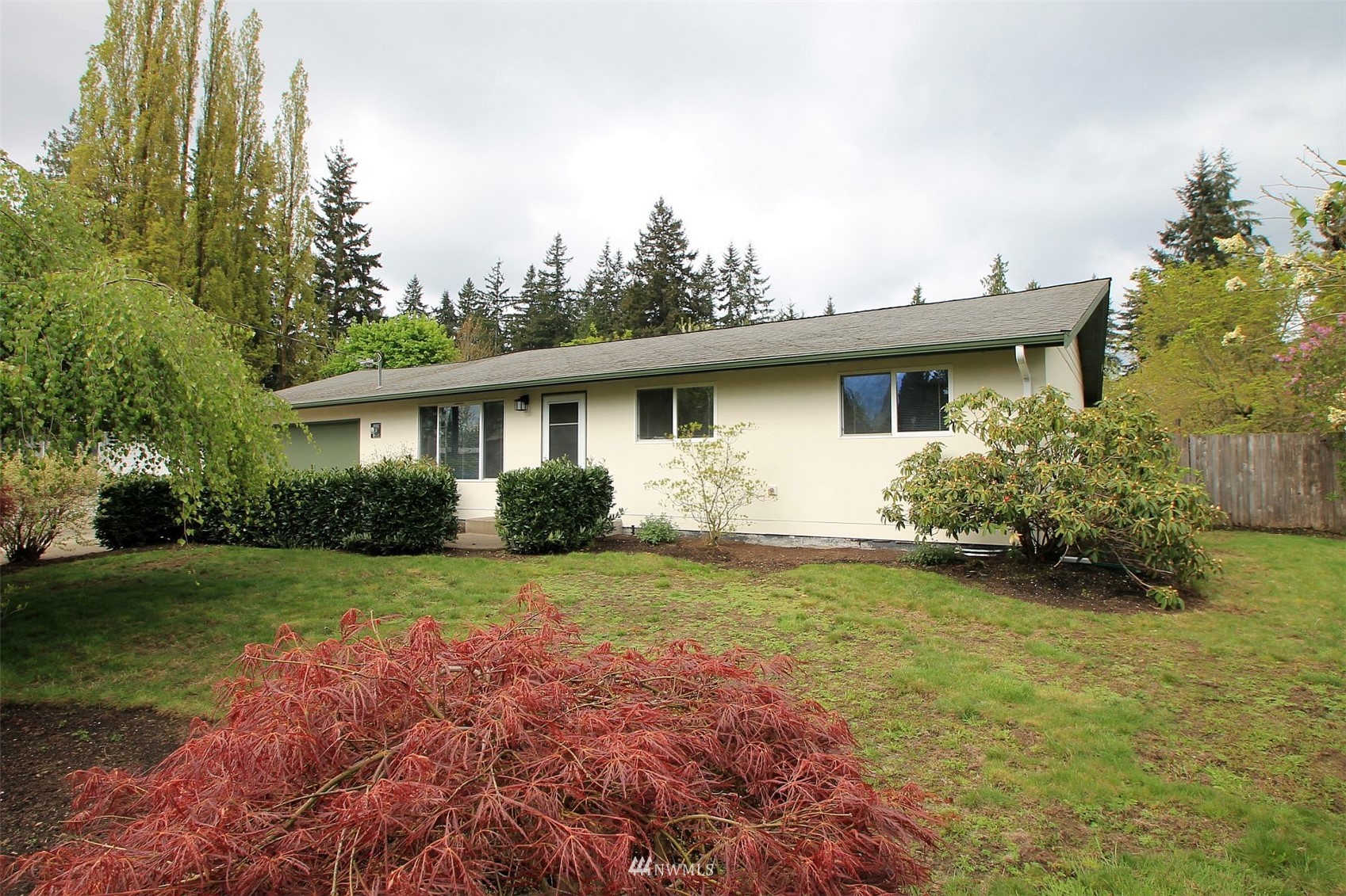19504 Winesap Lane Bothell, WA 98012 - Photo 1 of 23 a view of a house with backyard and garden