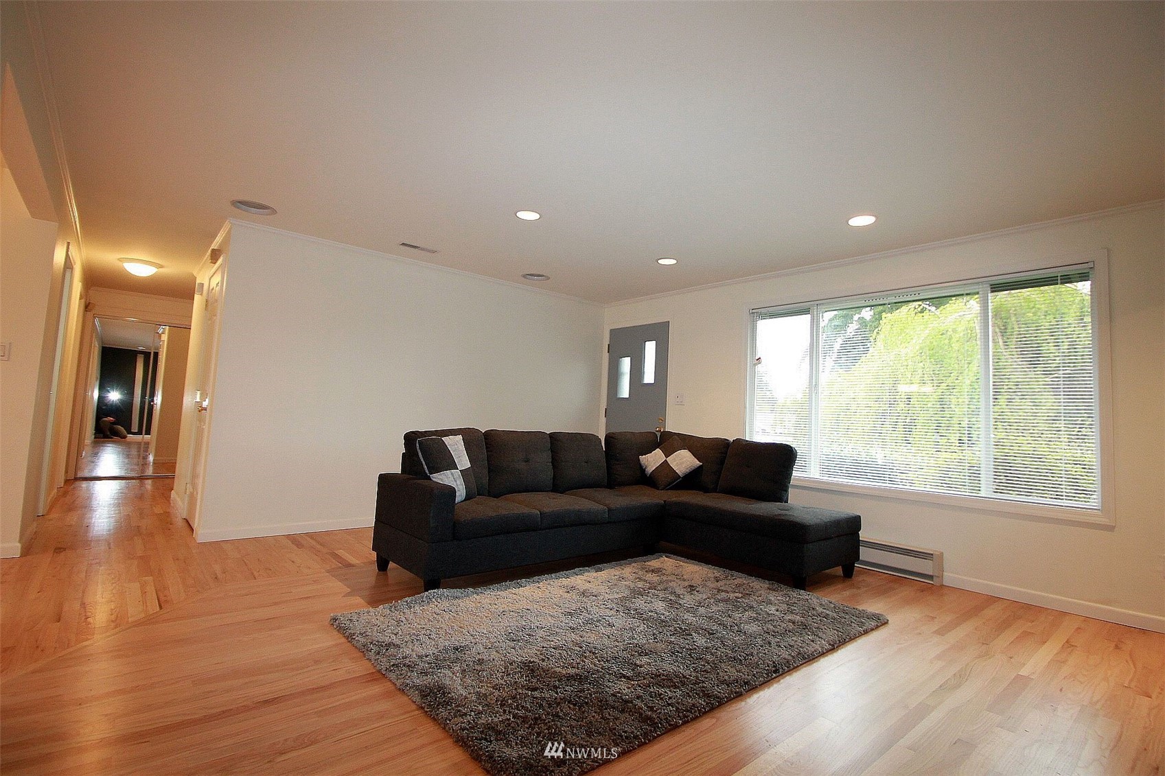 19504 Winesap Lane Bothell, WA 98012 - Photo 11 of 23 a living room with furniture and a large window