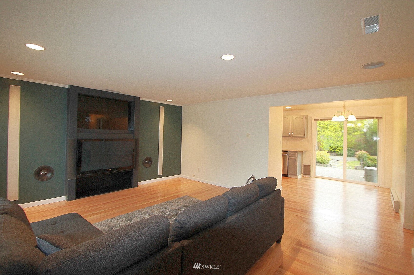 19504 Winesap Lane Bothell, WA 98012 - Photo 12 of 23 a bedroom with a bed and wooden floor