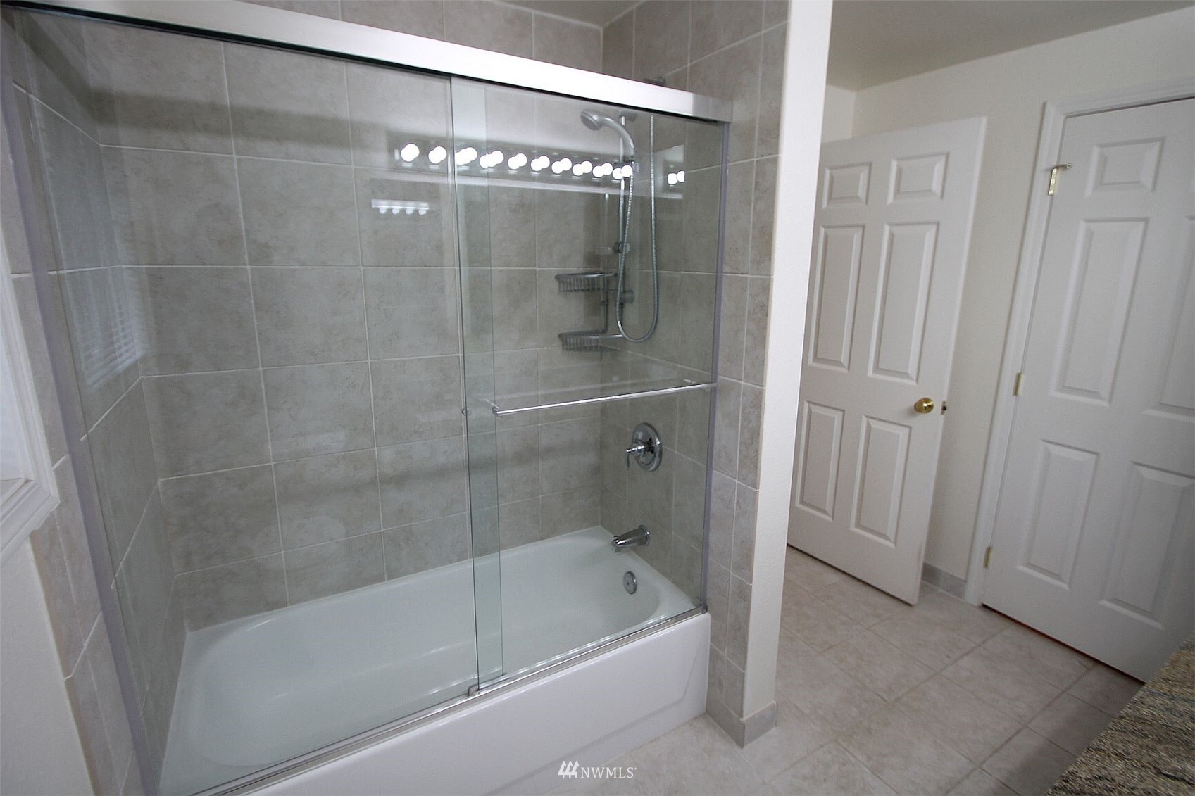 19504 Winesap Lane Bothell, WA 98012 - Photo 15 of 23 a bathroom with a bathtub