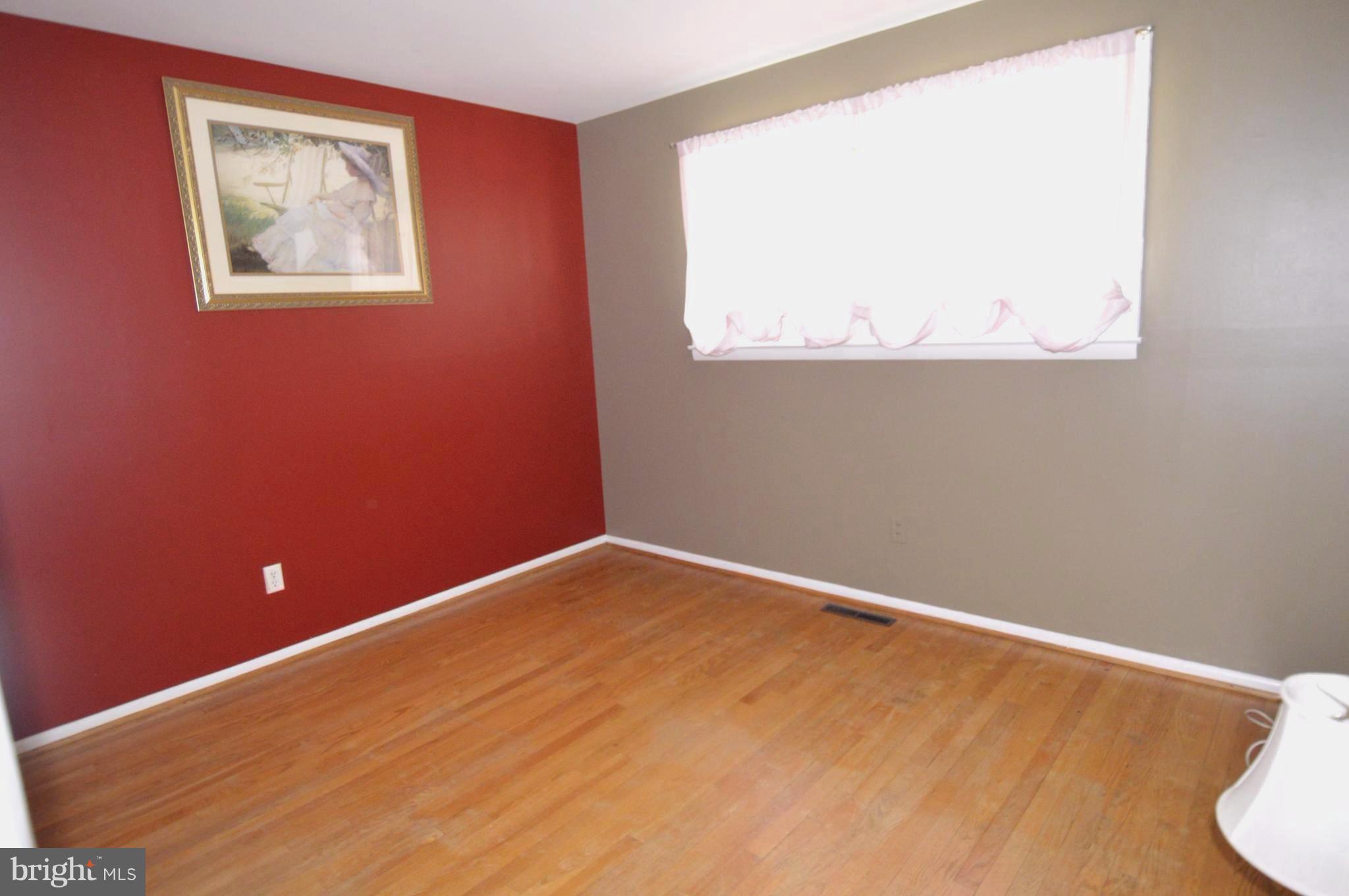 1730 Weyburn Road Baltimore, MD 21237 - Photo 13 of 25 a view of an empty room with a window