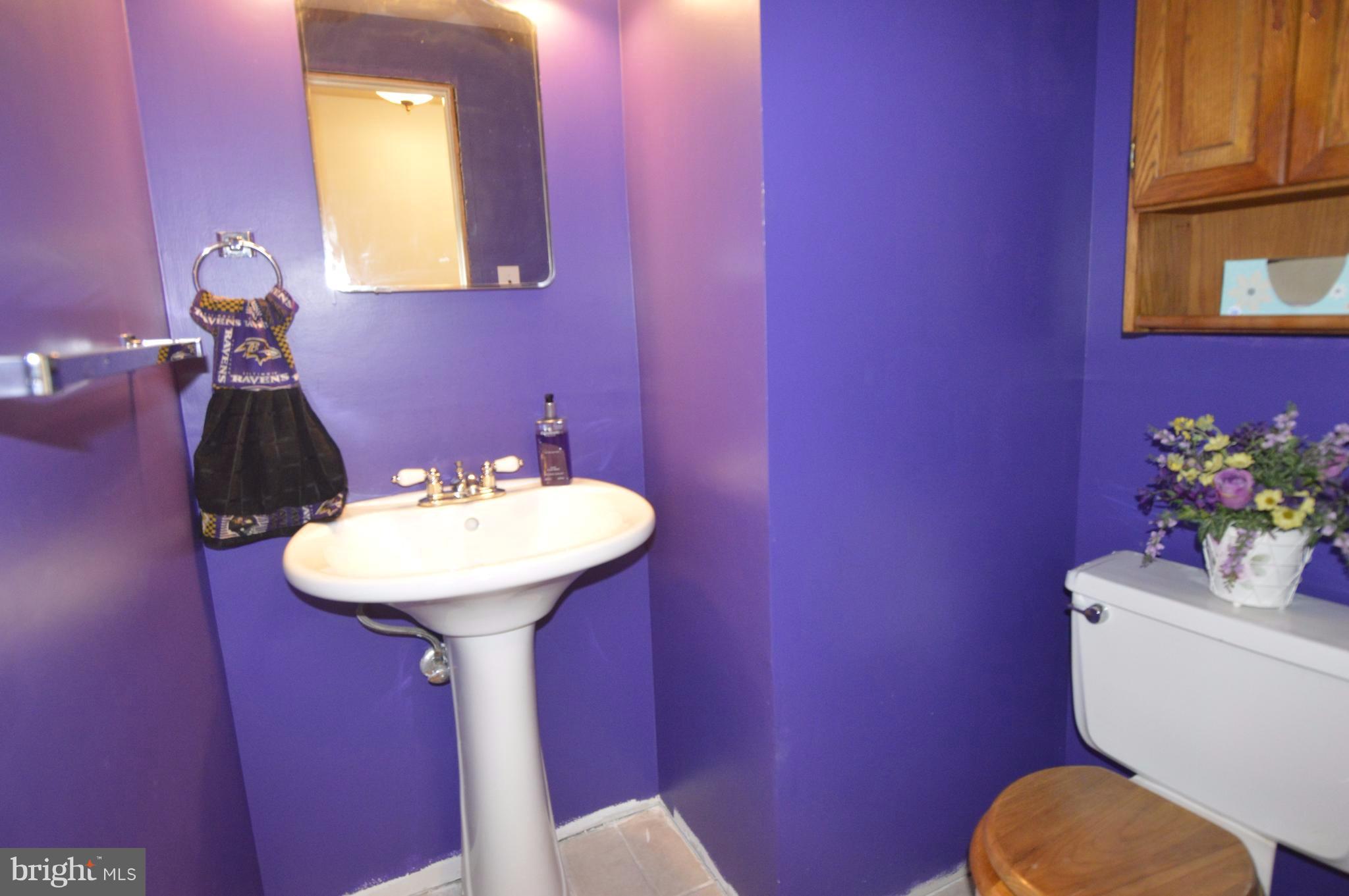 1730 Weyburn Road Baltimore, MD 21237 - Photo 16 of 25 a bathroom with a sink mirror and toilet