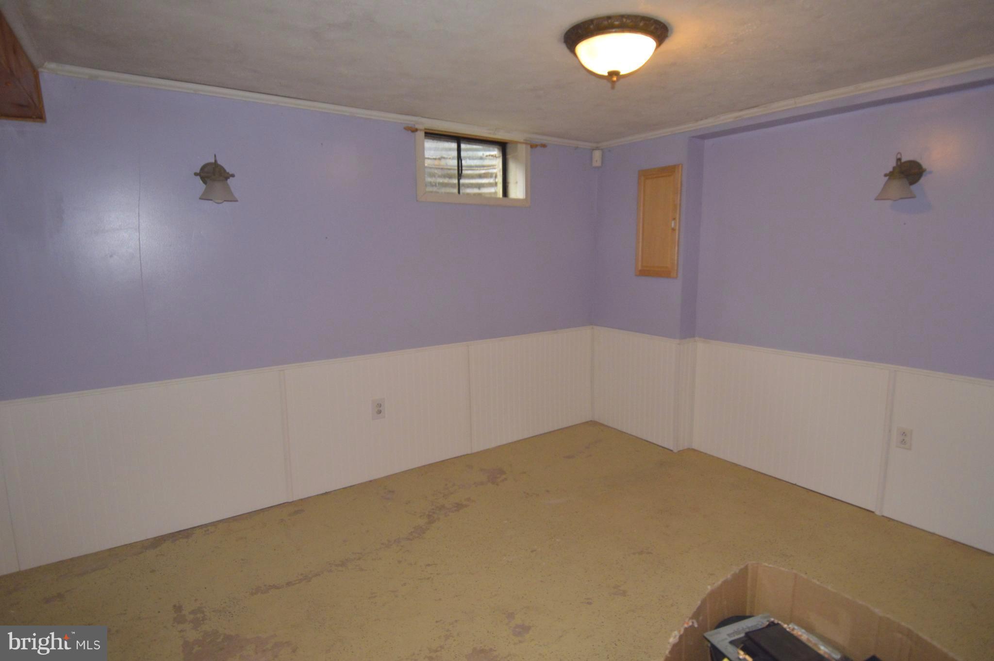 1730 Weyburn Road Baltimore, MD 21237 - Photo 17 of 25 an empty room with a workbench