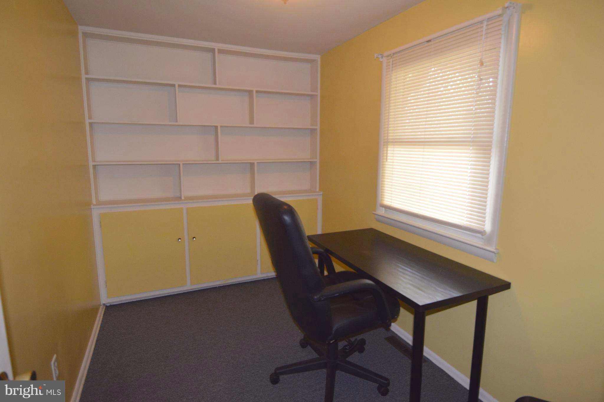 1730 Weyburn Road Baltimore, MD 21237 - Photo 18 of 25 a view of a workspace with furniture and a window