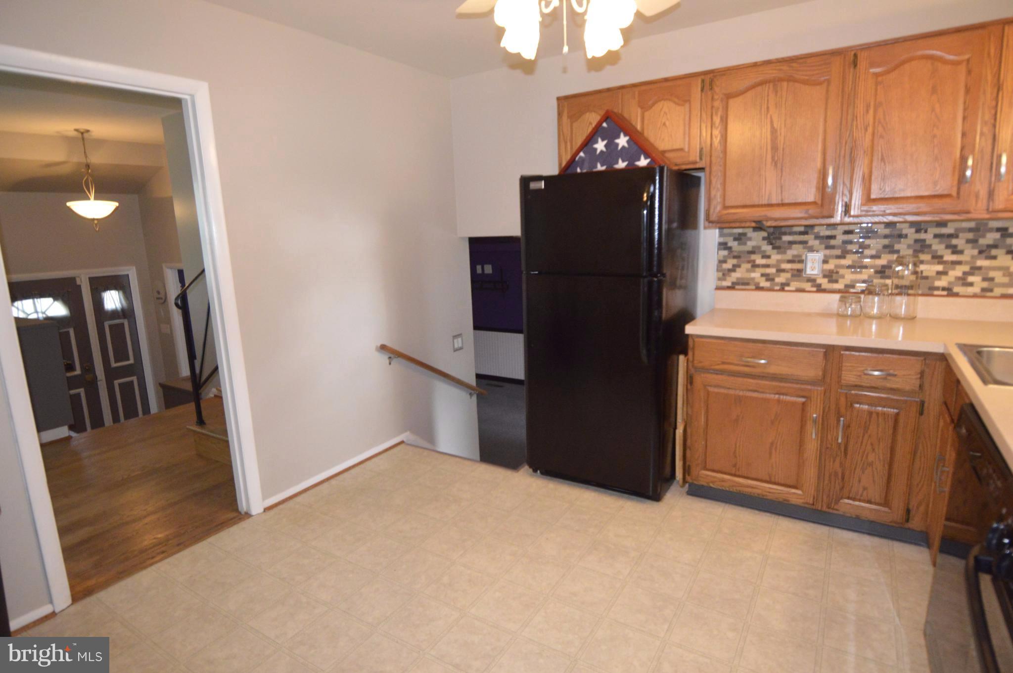 1730 Weyburn Road Baltimore, MD 21237 - Photo 4 of 25 a view of a refrigerator and mirror