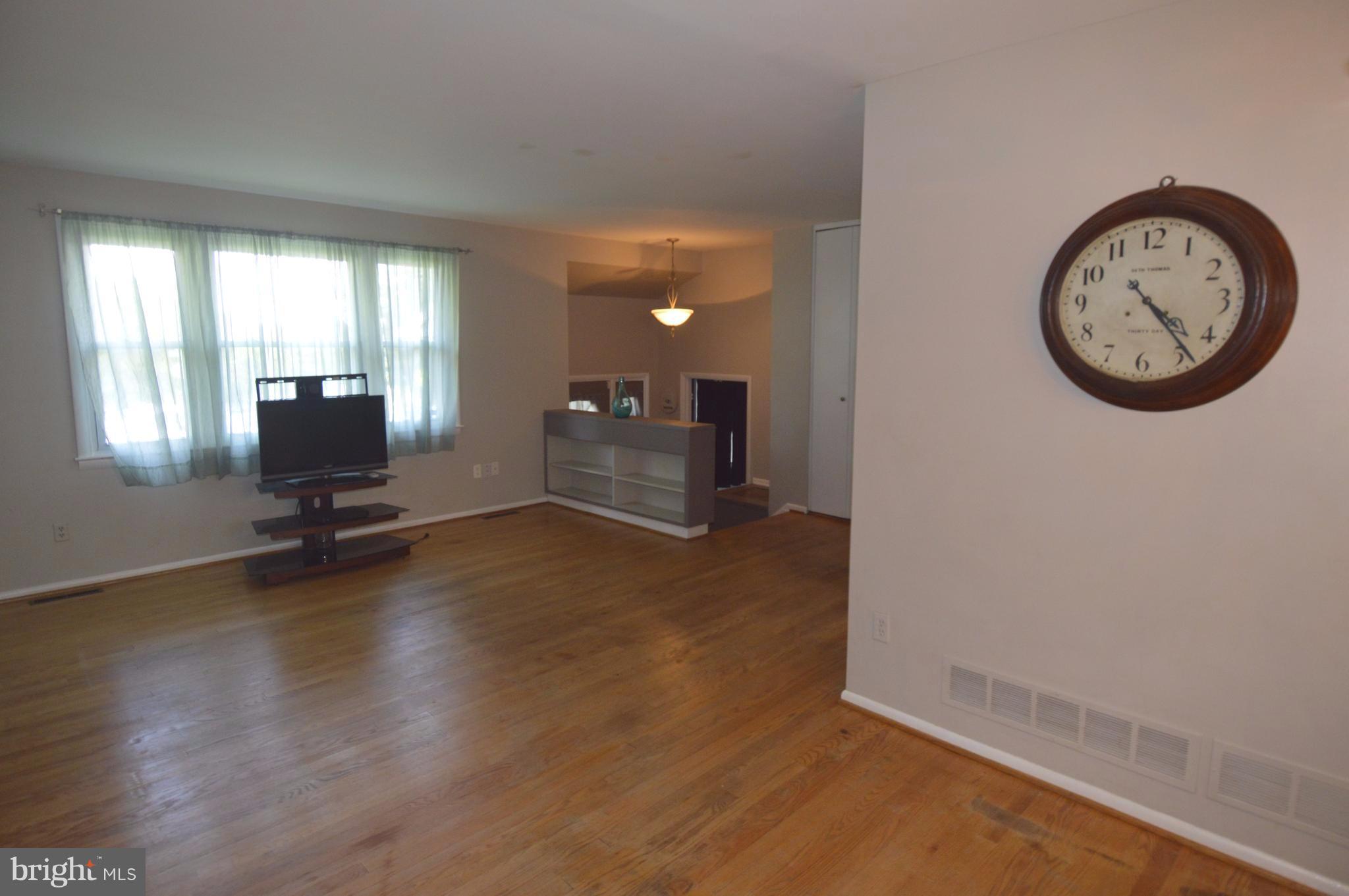 1730 Weyburn Road Baltimore, MD 21237 - Photo 6 of 25 a view of a livingroom with furniture wooden floor and a window