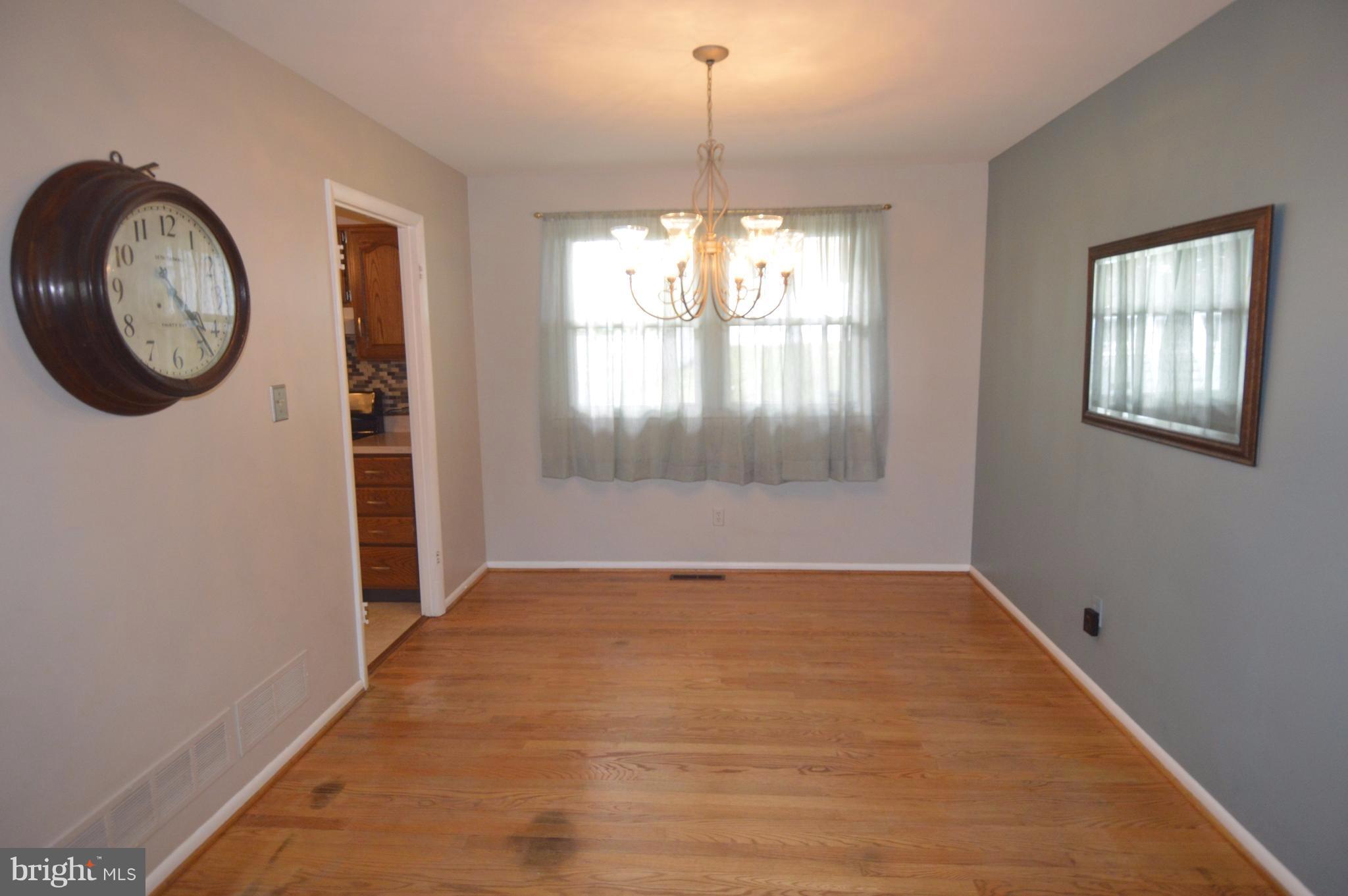 1730 Weyburn Road Baltimore, MD 21237 - Photo 7 of 25 a view of a hallway with windows