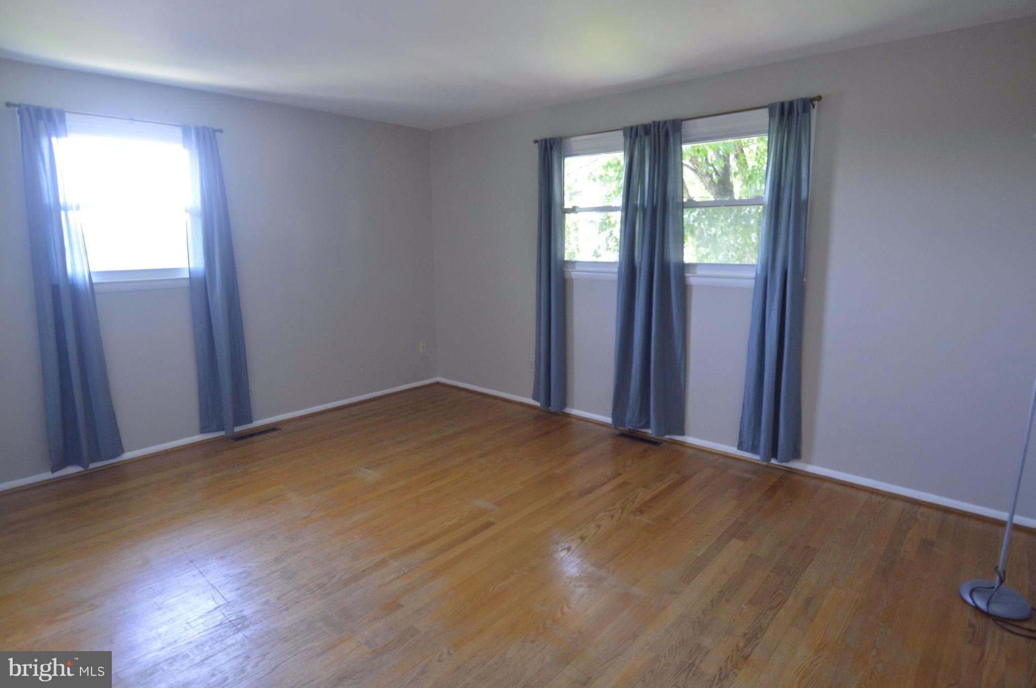 1730 Weyburn Road Baltimore, MD 21237 - Photo 9 of 25 an empty room with windows