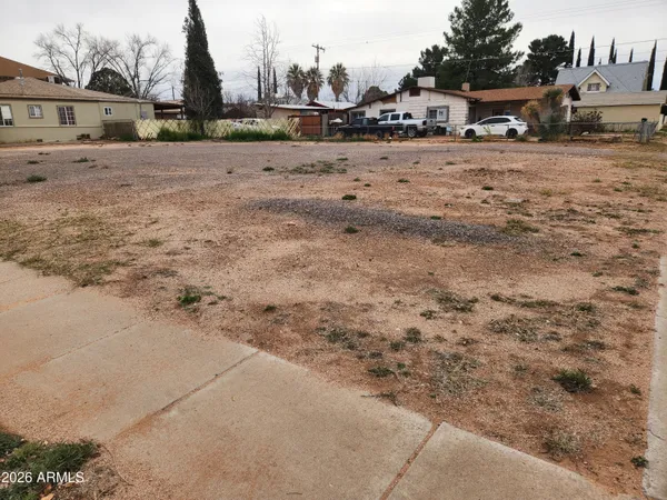 a view of road with card parked
